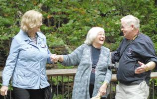Huston with sister Maryann and brother Tom