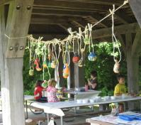 painted gourds hanging from shelter house