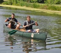 two people canoeing