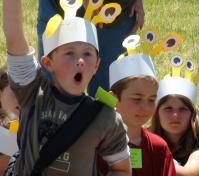 camper raising hand excitedly