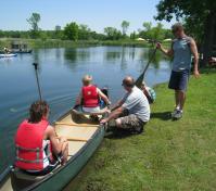 people getting ready to go canoeing