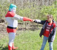 Kids interacting with superheroes