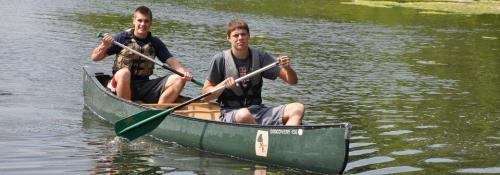 two people canoeing