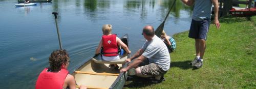 people getting ready to go canoeing