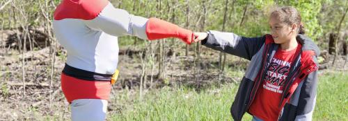 Kids interacting with superheroes
